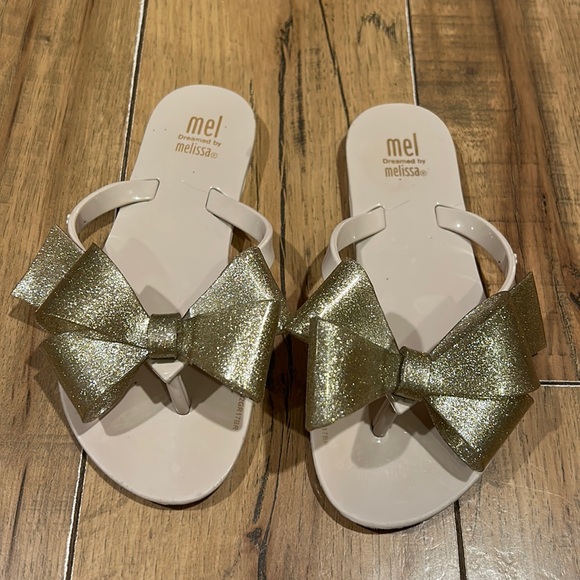 Mini Melissa Other - Mel Dreamed by Melissa. Size 12. Nude with gold sparkle bow.